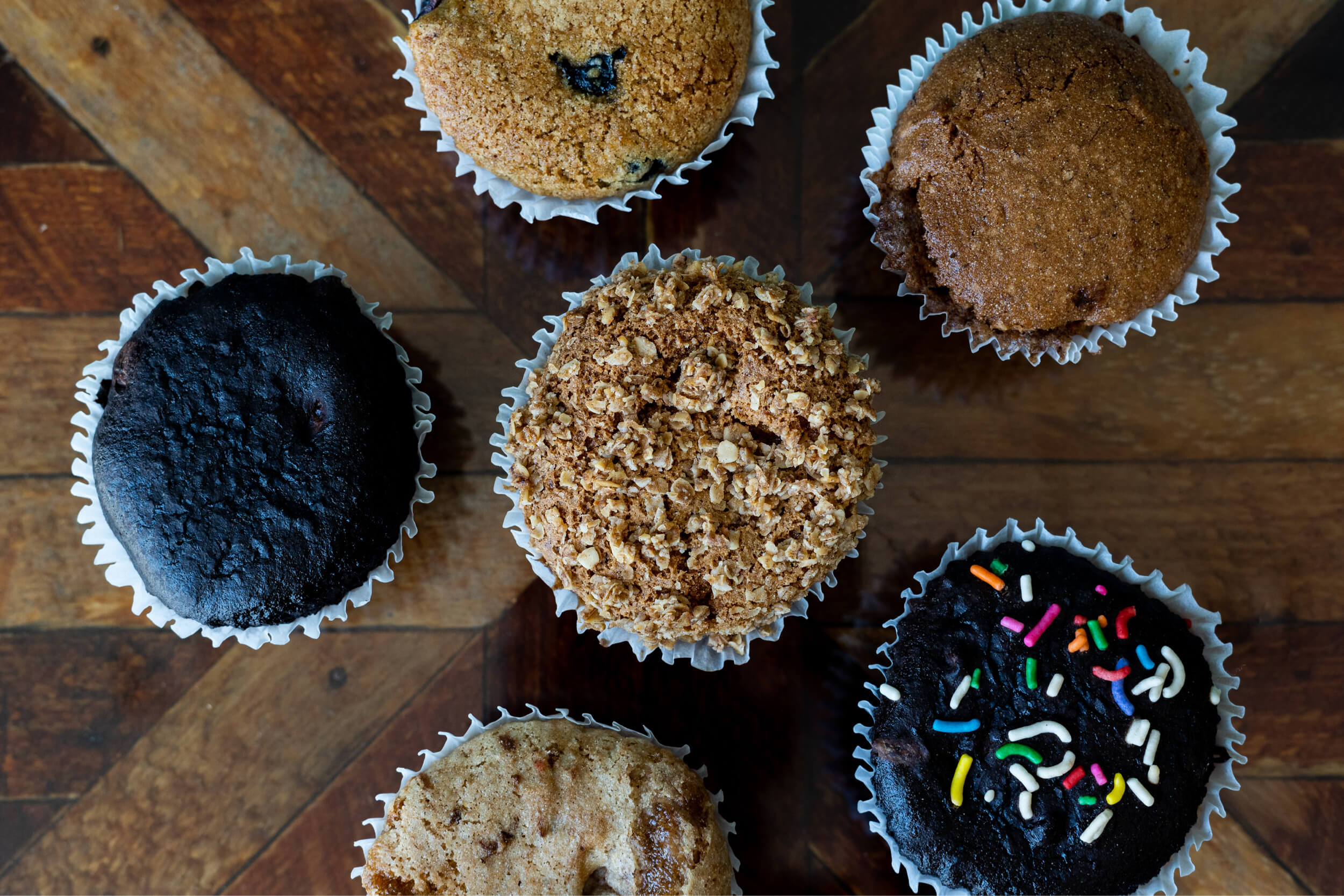assorted muffins on table close up assorted muffins on table close up